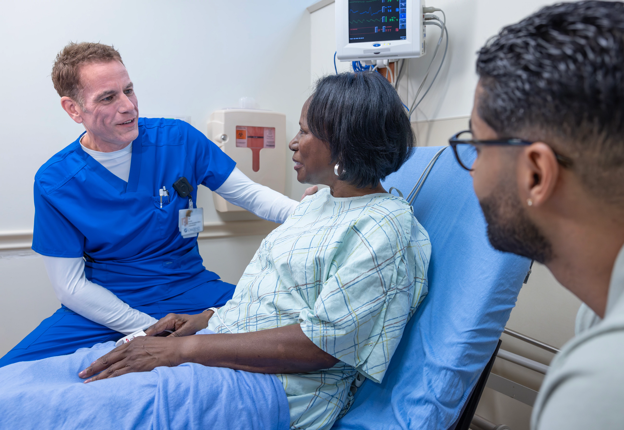 Patient receiving care in hospital bed